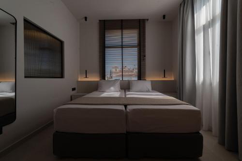 Katil atau katil-katil dalam bilik di Palladion Boutique Hotel