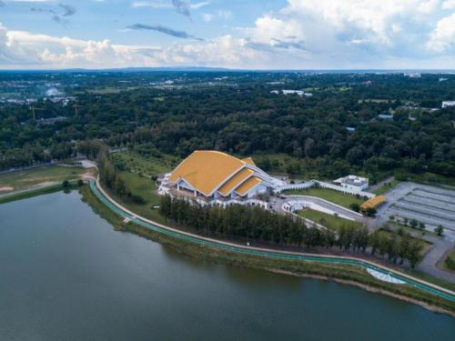 an aerial view of a building next to a body of water at Cactus Resort & Hotel in Khon Kaen