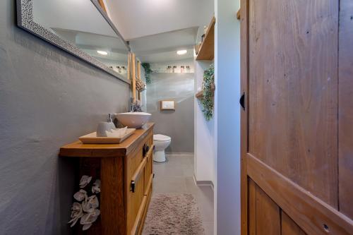 a bathroom with a sink and a toilet at House with pool, 50 meters from sea, privacy - by TRAVELER tourist agency Krk - ID 2137 in Kornić