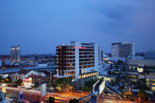 a view of a city at night with buildings at Hotel Grandhika Pemuda in Semarang