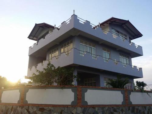 a large building with windows on top of it at Hotel Lans in Kandy