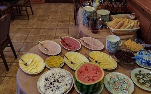 a table with plates of food on top at Penzion Rudolf in Liberec