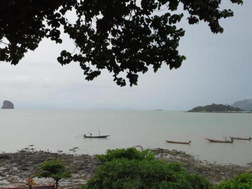 a group of boats on a large body of water at Wanghin Bungalow in Surat Thani