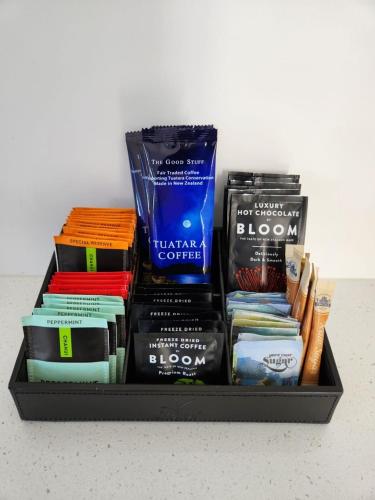 a tray filled with books on a table at *** LAKE VILLA 466 *** in Hanmer Springs