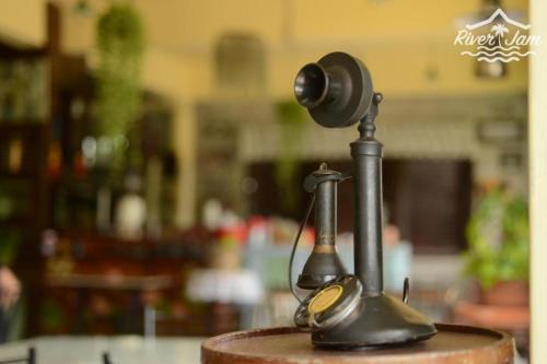 a camera sitting on top of a table at River Jam Amphawa in Amphawa