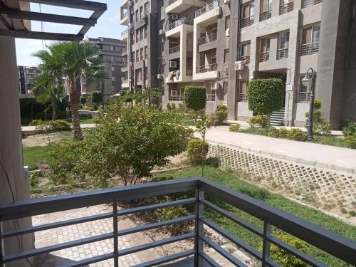 a view from the balcony of the apartment at Cozy G Apartment with Garden View - 2 Beds in Dar Misr Compound, Sheikh Zayed in Sheikh Zayed
