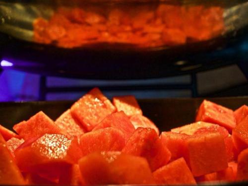 a pile of cut up fruit in a pan at Weida Hotel Jinhua in Jinhua
