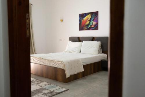 Postel nebo postele na pokoji v ubytování Stylish 3rd Floor Apartment in the Heart of New Cairo