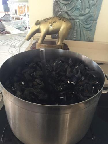 a pot full of food with a statue in it at Hotel Lady Mary in Milano Marittima
