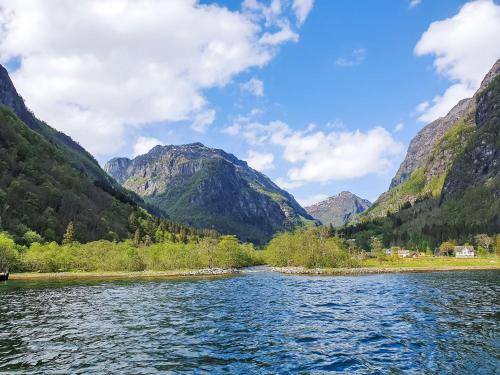 a view of a river with mountains in the background at Holiday Home Ørviksnes by Interhome in Steinstø