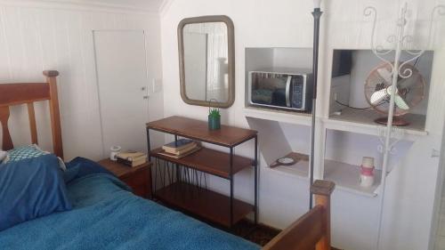 En eller flere senge i et værelse på The Olive Forest Garden Loft