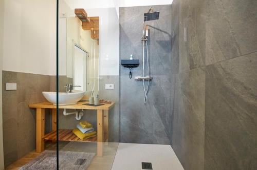 a bathroom with a sink and a shower at Ca' Brazzo Bed Relais in Pontecasale