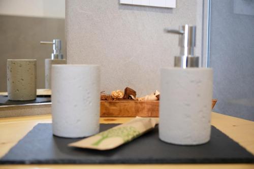a counter with two rolls of toilet paper and a knife at Ca' Brazzo Bed Relais in Pontecasale