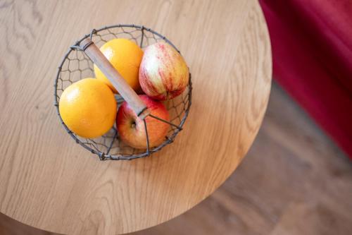 a basket of fruit sitting on a table at Landhaus Gabriele in Filzmoos