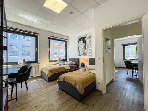 Katil atau katil-katil dalam bilik di Downtown Apartments