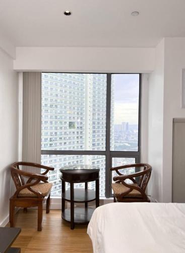 Ένα ή περισσότερα κρεβάτια σε δωμάτιο στο Acqua PRIVATE Residences
