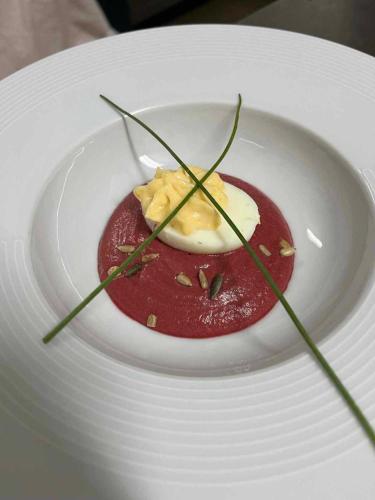 a dessert on a white plate on a table at La Sapinière St Lary Soulan in Saint-Lary-Soulan