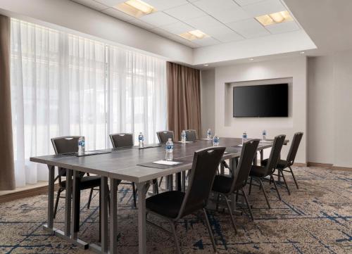 a conference room with a long table and chairs at Homewood Suites by Hilton Boston Brookline-Longwood Medical in Brookline