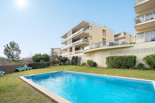 a swimming pool in front of a apartment building at Lagos Terrace with Pool by Homing in Lagos