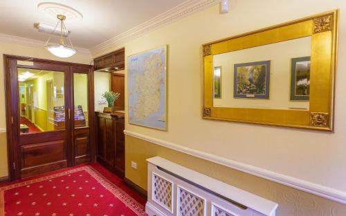 a hallway with a map on the wall at Ashville House in Killarney