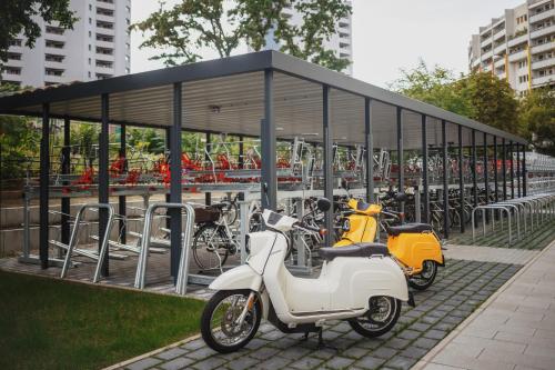 a group of motorcycles parked in a parking lot at The Circus Living in Berlin