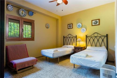 Ένα ή περισσότερα κρεβάτια σε δωμάτιο στο casa rural Ribera del Hueznar