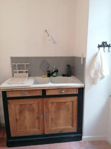 a kitchen with a sink and a counter at La Casa del Rio in Durtal