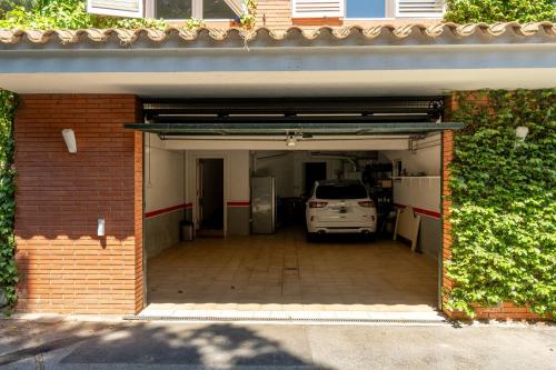 a garage with a car parked inside of it at Casa Zen Pool and Views in Cabrils