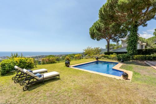 a swimming pool in the yard of a house at Casa Zen Pool and Views in Cabrils