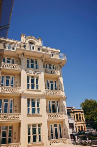 a tall white building with a sign on it at The Stay Bosphorus in Istanbul