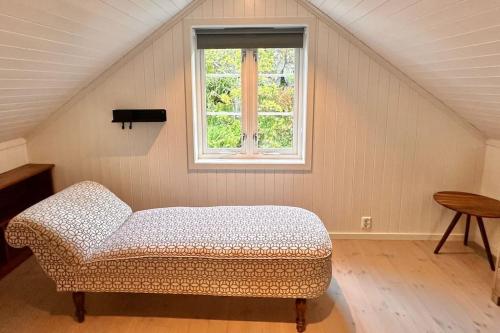Giường trong phòng chung tại Bay Chalet Sørvågen