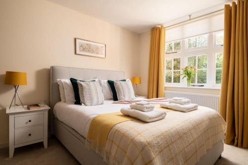 En eller flere senge i et værelse på Middle Wing - Norfolk Cottage Agency