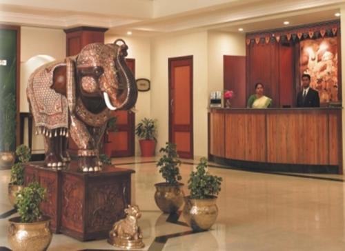 an elephant statue in the lobby of a hotel at Renest Shraddha Inn - Shirdi in Shirdi