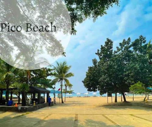 a view of a beach with trees and a building at Miranda B 319 at Pico de Loro by Raquels Place in Nasugbu