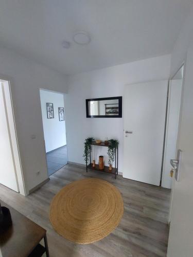 a living room with a circular rug on the floor at Speelberger Oase in Speelberg