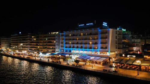 a building with blue lights on the side of the water at Lucy Hotel in Chalkida