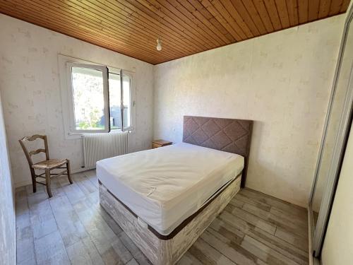 Giường trong phòng chung tại Le Val de Vie