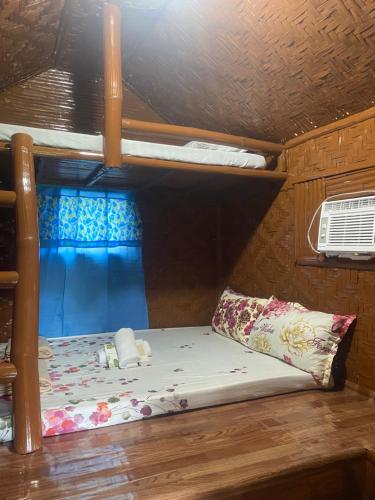 a bunk bed with a pillow in a room at Eco Park - Albur Rental Properties in Alburquerque