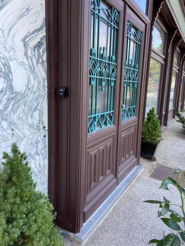 a wooden door with glass windows on a building at Villa AlexanderCharmante Wohnung mit Bergblick, Villa Alexander in Semmering