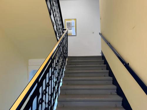 a stairway in a building with a railing at Villa AlexanderCharmante Wohnung mit Bergblick, Villa Alexander in Semmering