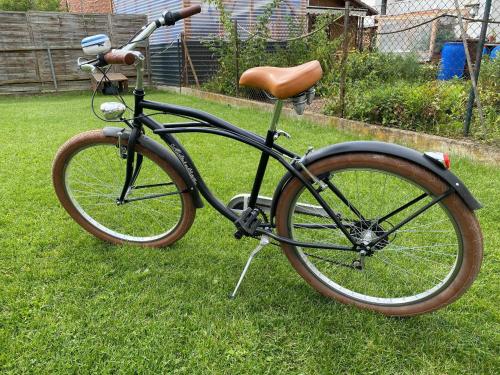 a bike parked in the grass in a yard at Ferienwohnung Sporn in Hemfurth-Edersee