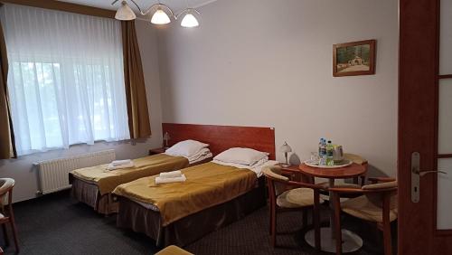 Ένα ή περισσότερα κρεβάτια σε δωμάτιο στο Hotel MCT
