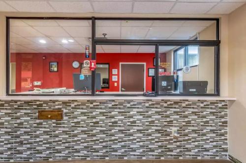 a lobby with a large glass window in a building at Americas Best Value Inn Opelika in Opelika