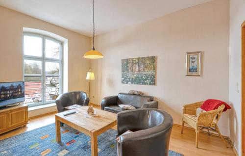 a living room with chairs and a table at Lovely Apartment In Krakow Am See in Krakow am See