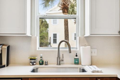 a kitchen sink with a window in a kitchen at Rockaway Beach in Santa Rosa Beach