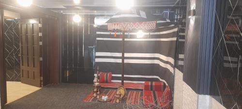 a room with a flag painted on the wall at Balcony Hotel in Amman