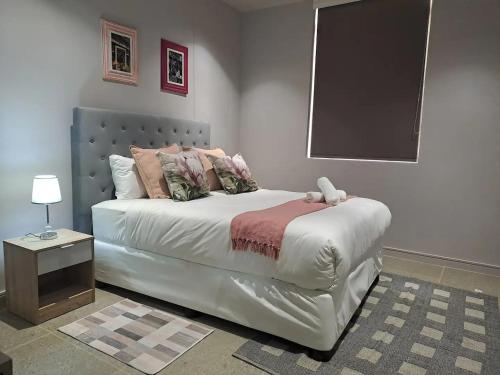 Ένα ή περισσότερα κρεβάτια σε δωμάτιο στο Unit 208 Zimbali Boulevard Edge