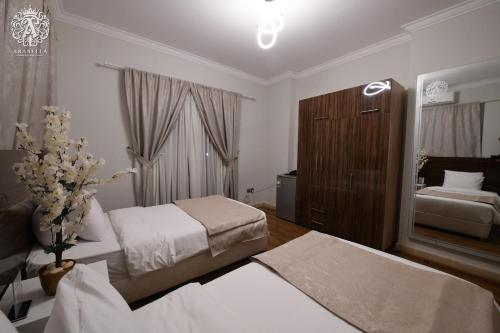 Una cama o camas en una habitación de Arabella Residence