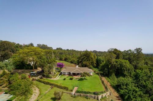 an aerial view of a house with a garden at Fairmont Mount Kenya Safari Club in Nanyuki