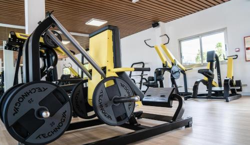 a gym with several tread machines in a room at Coral Cotillo Beach in Cotillo
